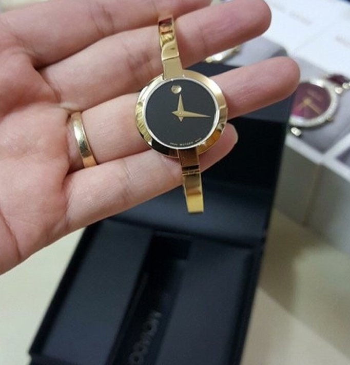 Movado Bela Black Dial Gold Steel Strap Watch For Women - 0606999 Buy Now By Movado