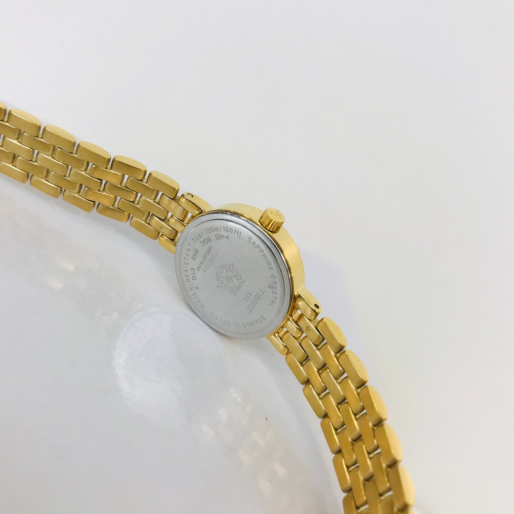 Tissot T-Lady Lovely Mother of Pearl Dial Gold Steel Strap Watch For Women - T058.009.63.116.00 Buy Now By Tissot