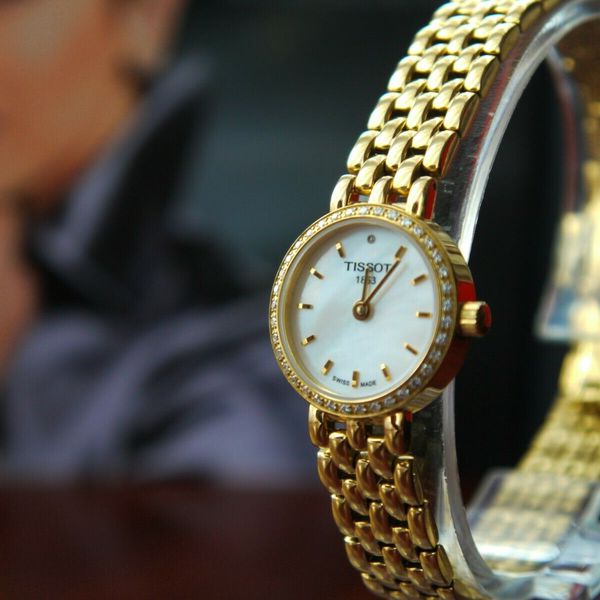 Tissot T-Lady Lovely Mother of Pearl Dial Gold Steel Strap Watch For Women - T058.009.63.116.00 Buy Now By Tissot