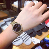 Guess Chelsea Crystals Black Dial Gold Mesh Bracelet Watch For Women - W0647L8 Buy Now By Guess