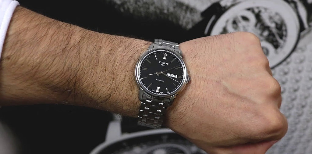 Tissot Automatics III Black Dial Silver Steel Strap Watch For Men - T065.430.11.051.00 Buy Now By Tissot