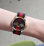 Gucci G Timeless Bee Red & Blue Dial Red Two Tone Nylon Strap Watch For Men - YA1264061 Buy Now By Gucci