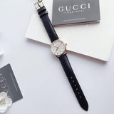 Gucci G-Timeless Mother of Pearl Dial Black Leather Strap Watch For Women - YA126589 Buy Now By Gucci