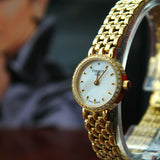 Tissot T-Lady Lovely Mother of Pearl Dial Gold Steel Strap Watch For Women - T058.009.63.116.00 Buy Now By Tissot