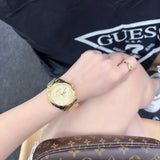 Guess Cubed Analog Gold Dial Gold Steel Strap Watch For Women - GW0606L2 Buy Now By Guess